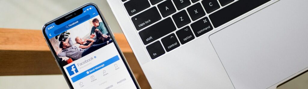iPhone X beside MacBook